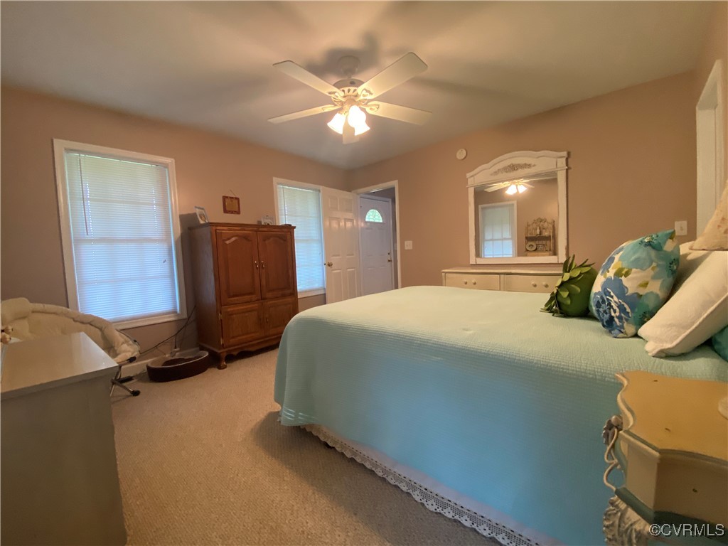 4554 Plank Road Kenbridge, VA 23944 - Photo 32 of 41 a bedroom with a bed and cabinets