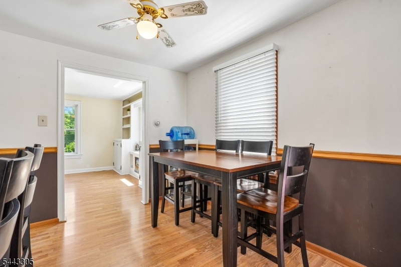 267 Kings Road Madison, NJ 07940 - Photo 7 of 37 a view of a dining room with furniture and chandelier
