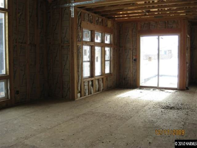 290 Neilson Road Reno, NV 89521 - Photo 4 of 9 a view of an empty room with a window
