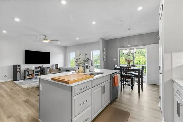 a kitchen with a refrigerator sink and microwave
