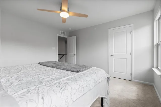 a view of a hallway with windows