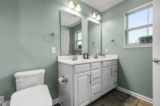 a bathroom with a shower and a toilet