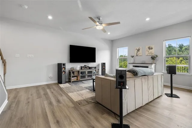 a view of a dining room with furniture window and wooden floor