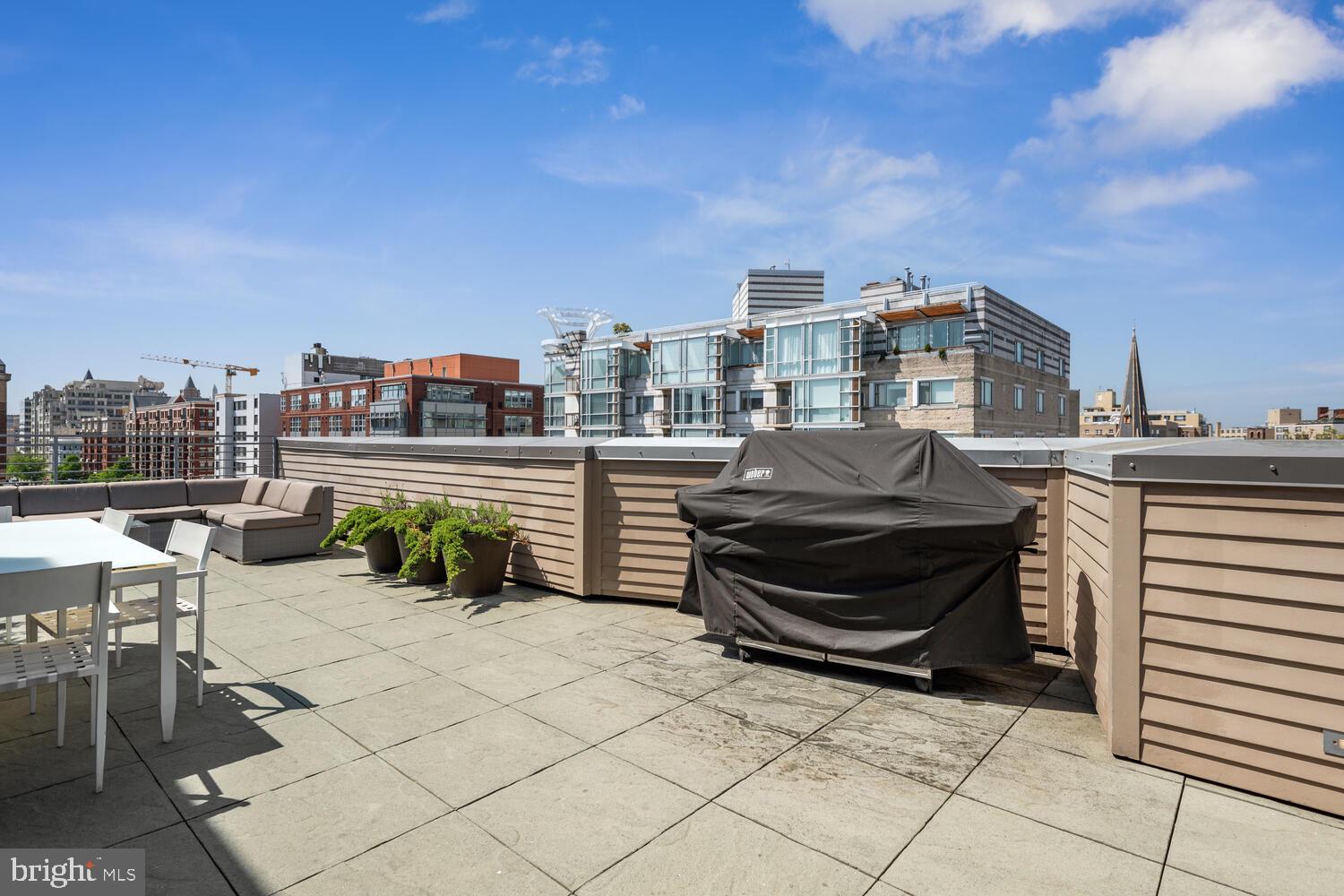 1311 13th Street Northwest, Unit 505 Washington, DC 20005 - Photo 25 of 43 Roof top terrace with grills and dining table