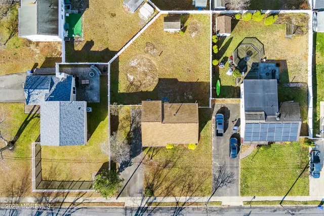 an aerial view of residential house with outdoor space and swimming pool