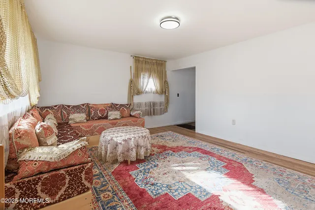 a living room with a bed and a couch