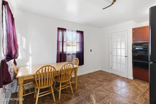 a view of a livingroom with furniture and windows