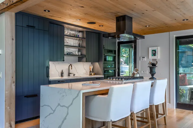 a dining table with chairs and window