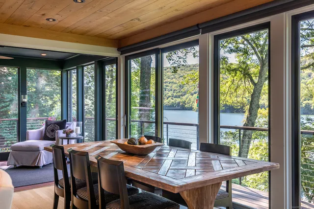 a view of a dining room with furniture and window