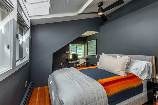 a bedroom with a bed and window