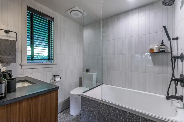 a bathroom with a sink a toilet and a bathtub