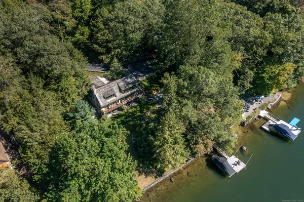 an aerial view of a house with a yard
