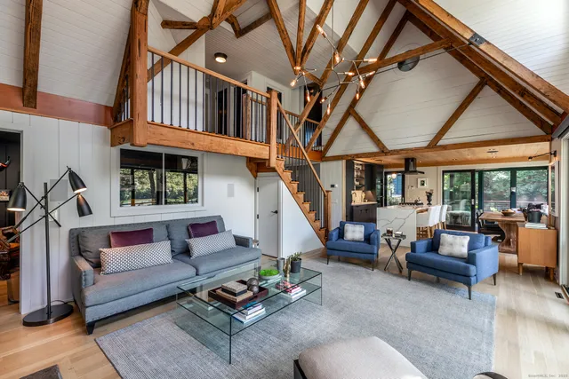 a living room with furniture or couch and a ceiling fan