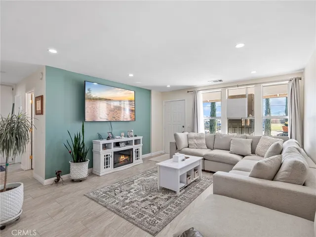 a kitchen with a refrigerator and a sink