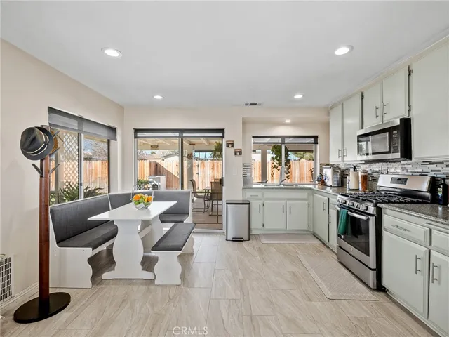 a view of a hallway with white walls and entryway