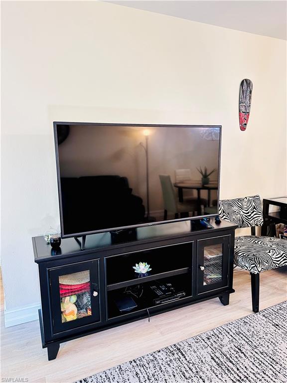 72 7th Street South, Unit 306 Naples, FL 34102 - Photo 12 of 23 a room with furniture and painting on the wall