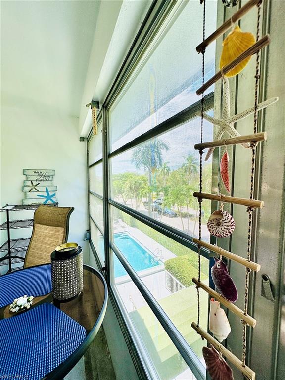 72 7th Street South, Unit 306 Naples, FL 34102 - Photo 17 of 23 a view of balcony with furniture