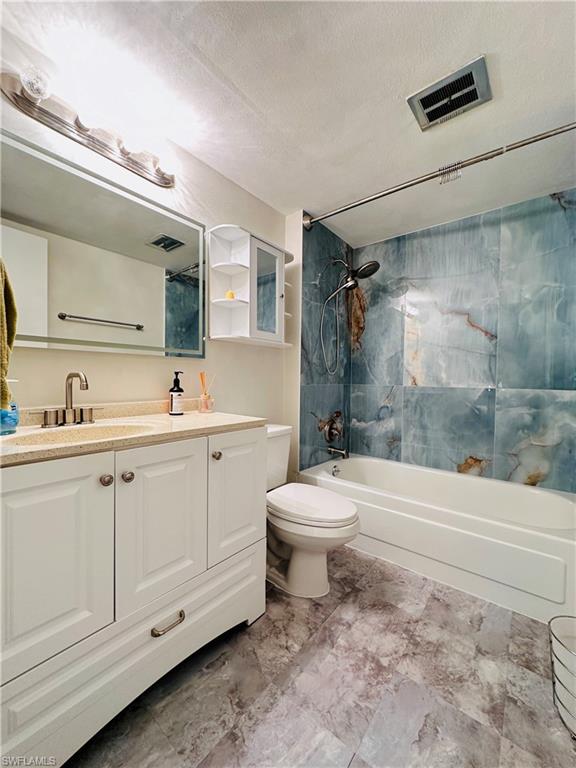 72 7th Street South, Unit 306 Naples, FL 34102 - Photo 20 of 23 a bathroom with a sink a toilet and shower