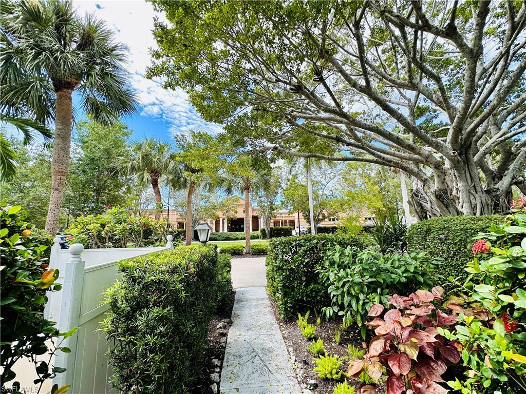 72 7th Street South, Unit 306 Naples, FL 34102 - Photo 22 of 23 a view of a garden with large trees