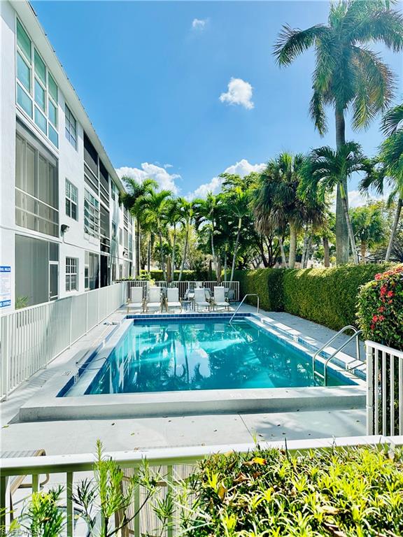 72 7th Street South, Unit 306 Naples, FL 34102 - Photo 23 of 23 a view of swimming pool with a outdoor seating
