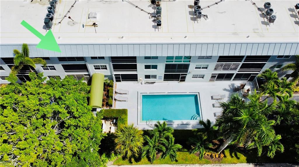 72 7th Street South, Unit 306 Naples, FL 34102 - Photo 3 of 23 a front view of a house with a yard