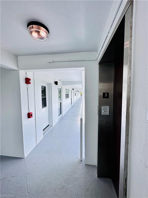 72 7th Street South, Unit 306 Naples, FL 34102 - Photo 7 of 23 a view of a livingroom with an empty space