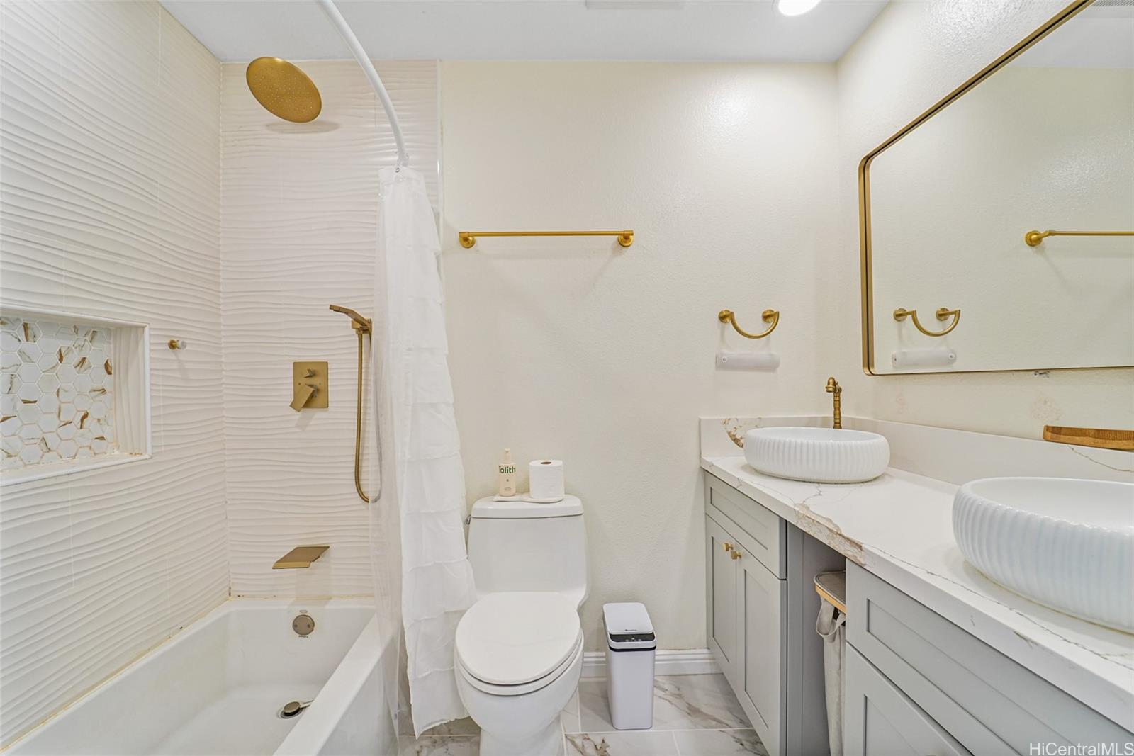 94-828 Lumiauau Street, Unit M204 Waipahu, HI 96797 - Photo 12 of 25 a bathroom with a granite countertop sink toilet and shower
