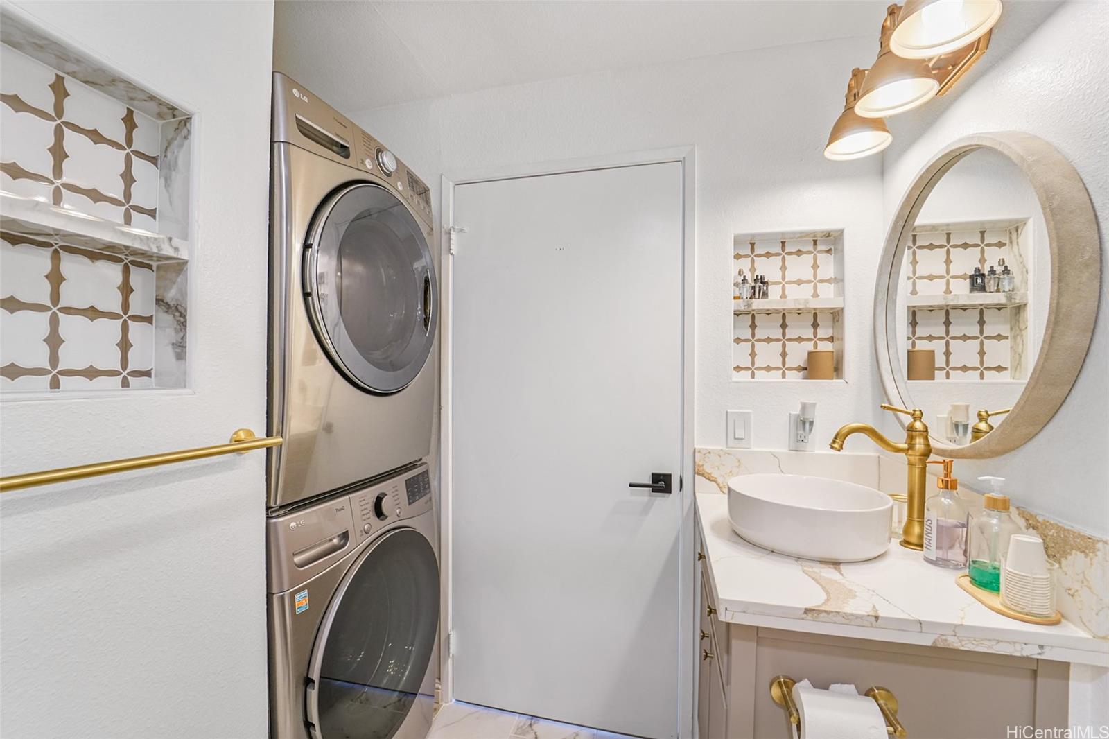 94-828 Lumiauau Street, Unit M204 Waipahu, HI 96797 - Photo 13 of 25 a view of a kitchen with washer and dryer