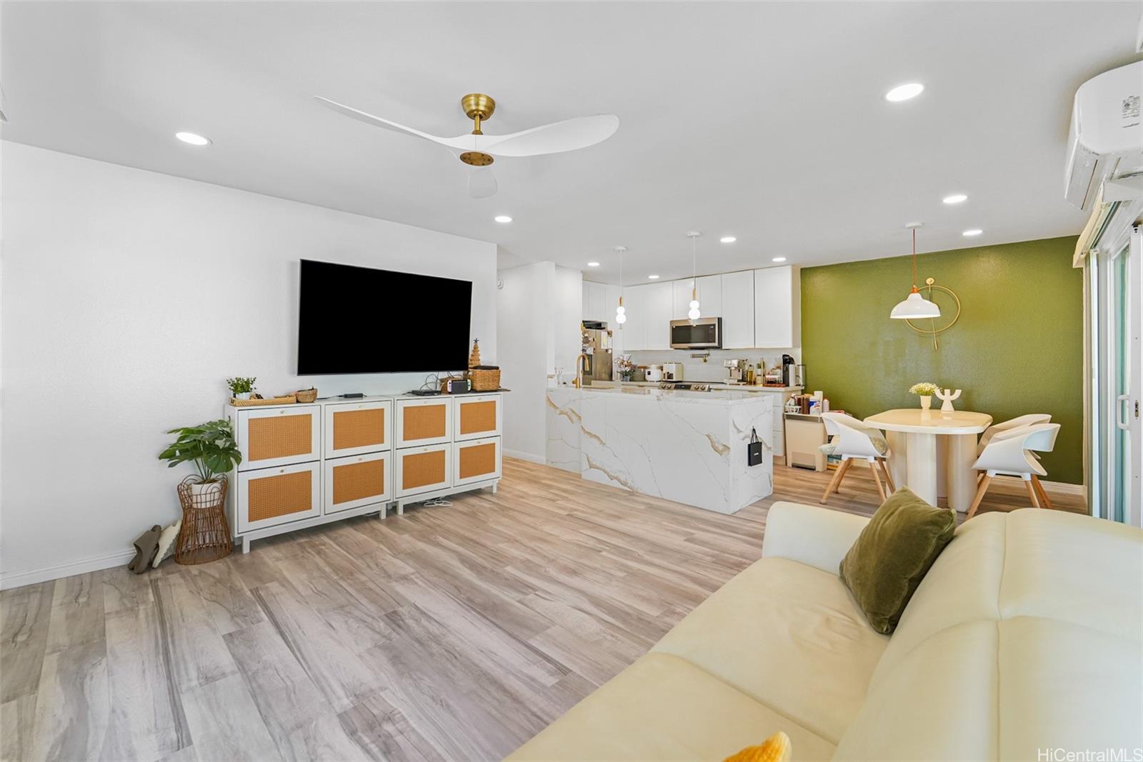 94-828 Lumiauau Street, Unit M204 Waipahu, HI 96797 - Photo 16 of 25 a living room with furniture and a flat screen tv
