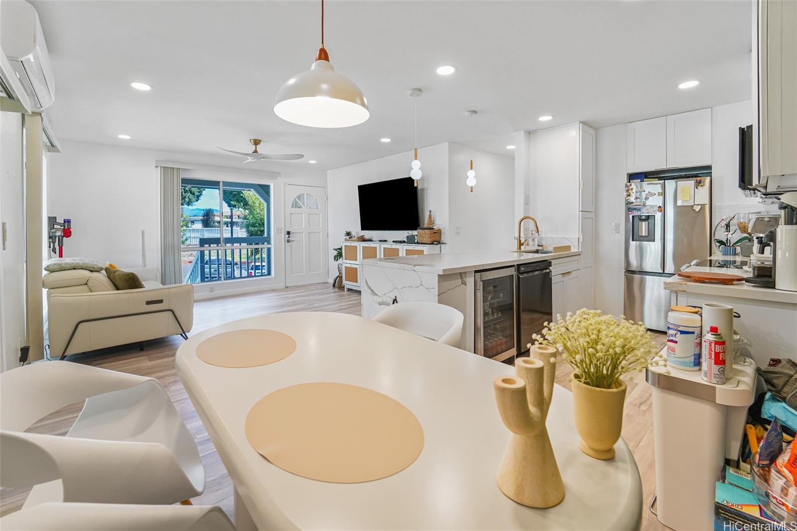 94-828 Lumiauau Street, Unit M204 Waipahu, HI 96797 - Photo 17 of 25 a living room with furniture and a flat screen tv