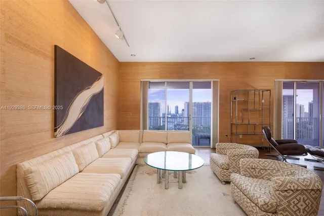 a living room with furniture and a table