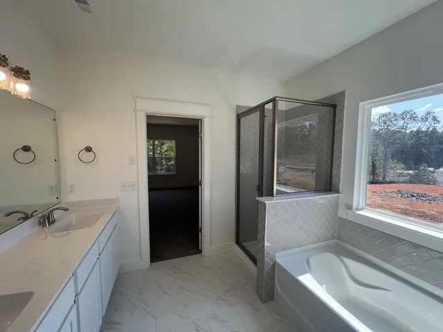 a bathroom with a bathtub and a sink