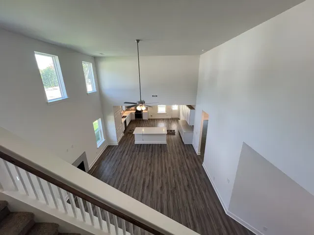a view of a couches and dinning table in a balcony