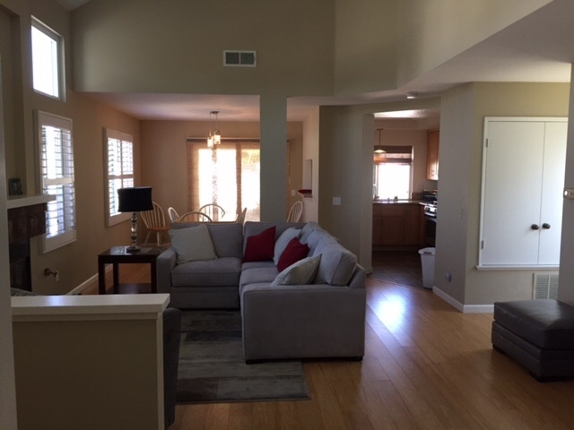 822 Bluewater Road Carlsbad, CA 92011 - Photo 18 of 24 Family room with fireplaces, bamboo floors, and wood shutters.