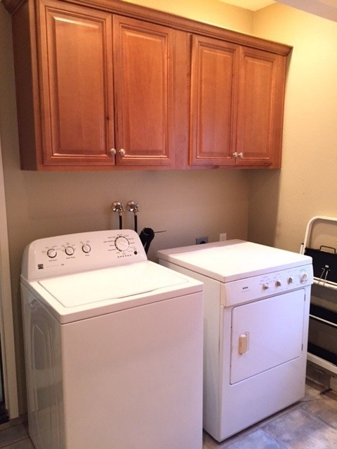 822 Bluewater Road Carlsbad, CA 92011 - Photo 7 of 24 Laundry room with lots of cabinetry with granite countertops.