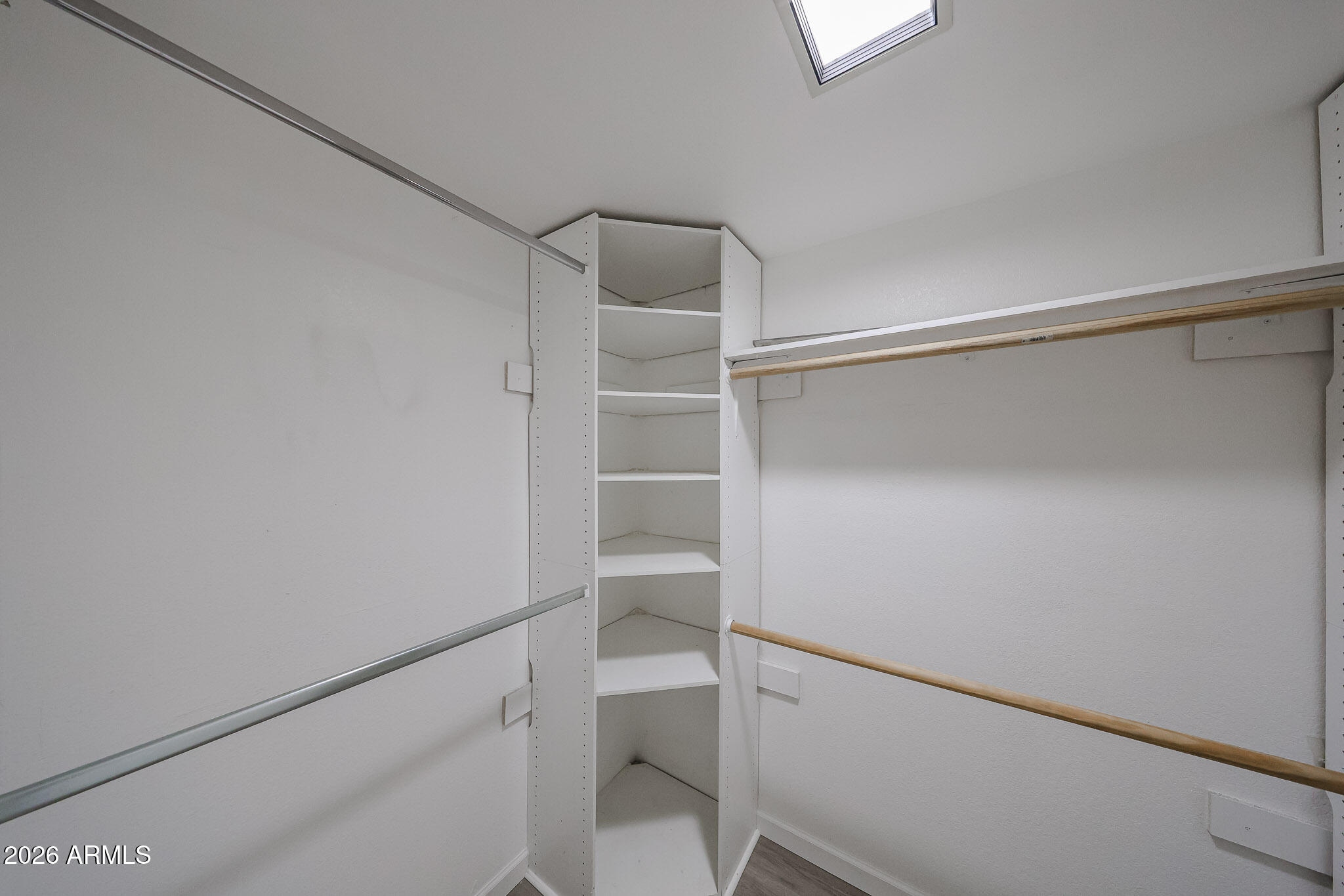 10410 North Cave Creek Road, Unit 1011 Phoenix, AZ 85020 - Photo 22 of 54 a view of an empty walk in closet