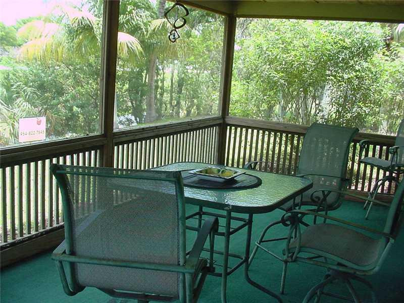 22729 Southwest 56th Avenue Boca Raton, FL 33433 - Photo 17 of 24 a view of a chairs in patio