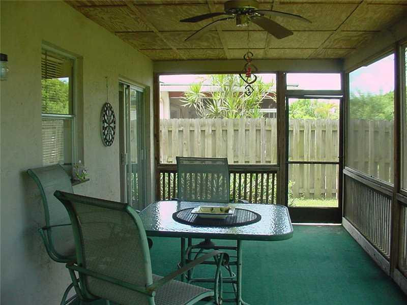 22729 Southwest 56th Avenue Boca Raton, FL 33433 - Photo 2 of 24 a view of a chairs and table in the patio
