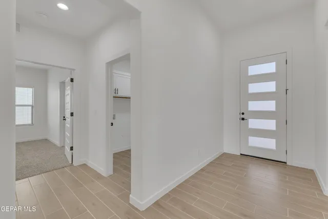 a view of an empty room with a window