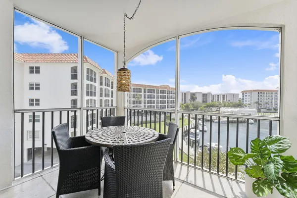 a view of a balcony with chair and table