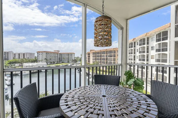 a view of a balcony with wooden floor