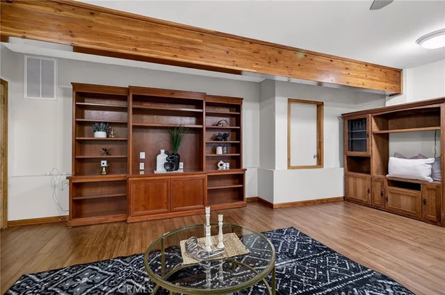 a view of room with a ceiling fan and window