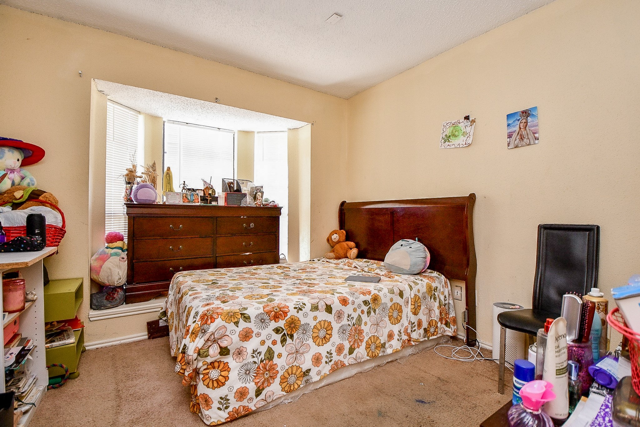 8628 Beechcrest Street Houston, TX 77083 - Photo 11 of 20 a bedroom with a bed and wooden floor