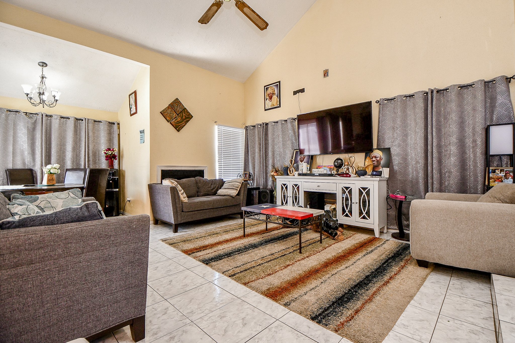 8628 Beechcrest Street Houston, TX 77083 - Photo 3 of 20 a living room with furniture and a flat screen tv