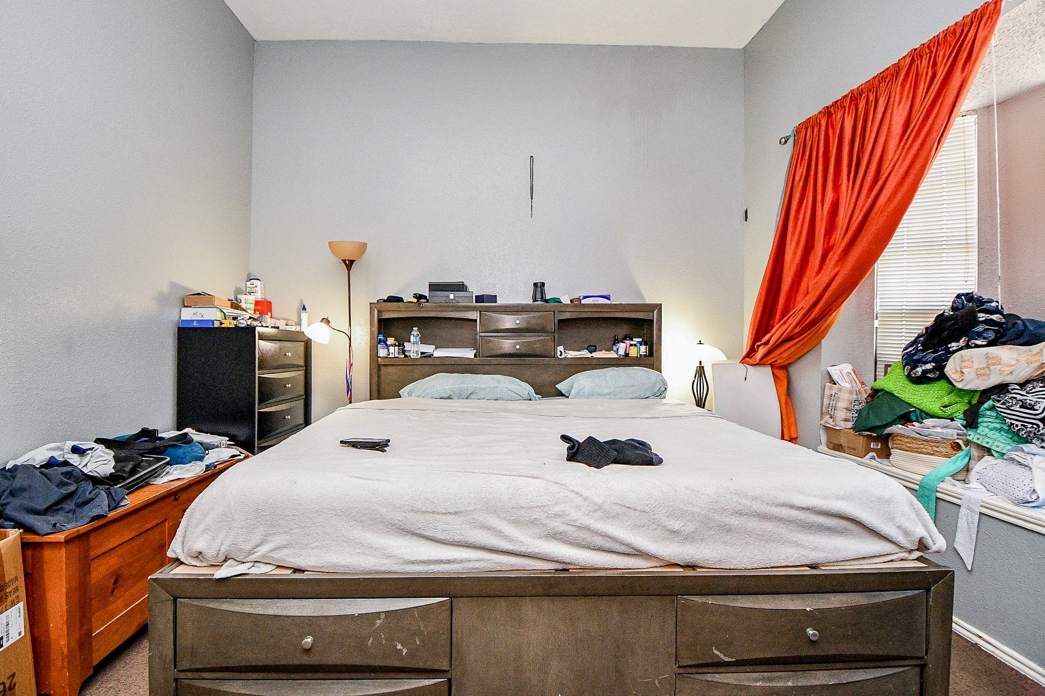 8628 Beechcrest Street Houston, TX 77083 - Photo 8 of 20 a bed sitting in a bedroom next to a window