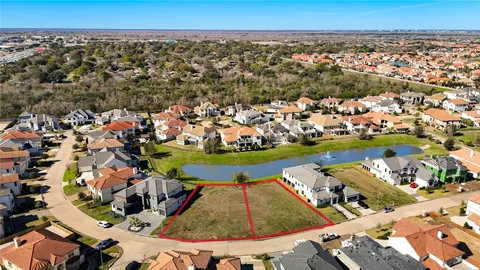 an aerial view of a house with a swimming pool yard and outdoor seating