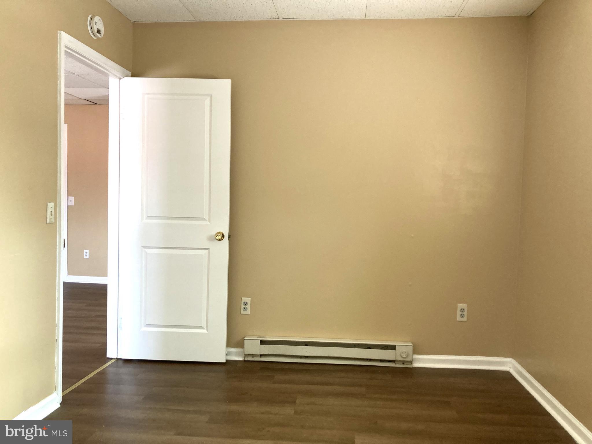 102 Delaware Road, Unit 3 Riegelsville, PA 18077 - Photo 7 of 11 a view of an empty room with wooden floor