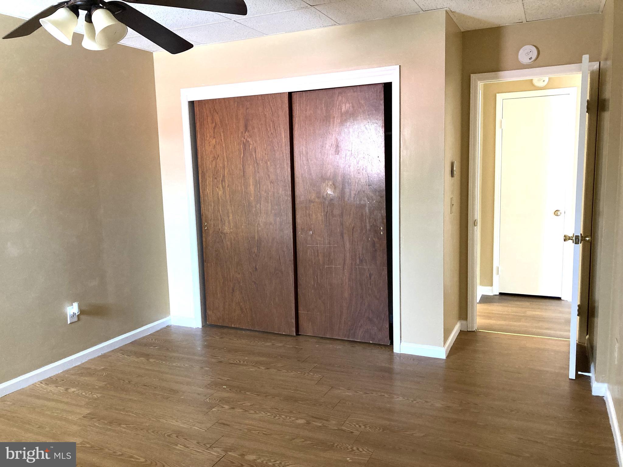 102 Delaware Road, Unit 3 Riegelsville, PA 18077 - Photo 10 of 11 a view of an empty room with wooden floor