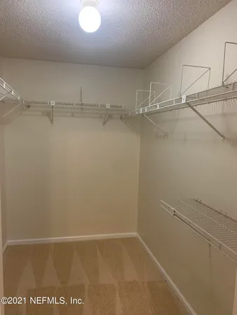 a view of an empty walk in closet