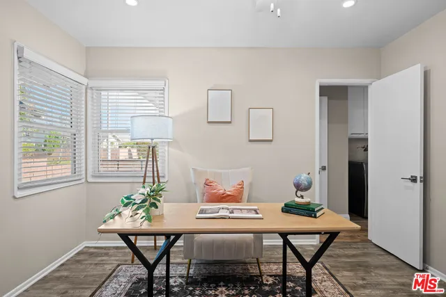 a workspace with furniture and window